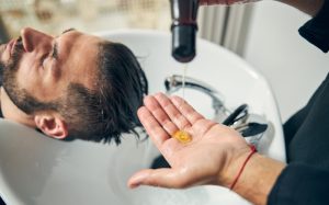 Photo of Barber shampooing a client